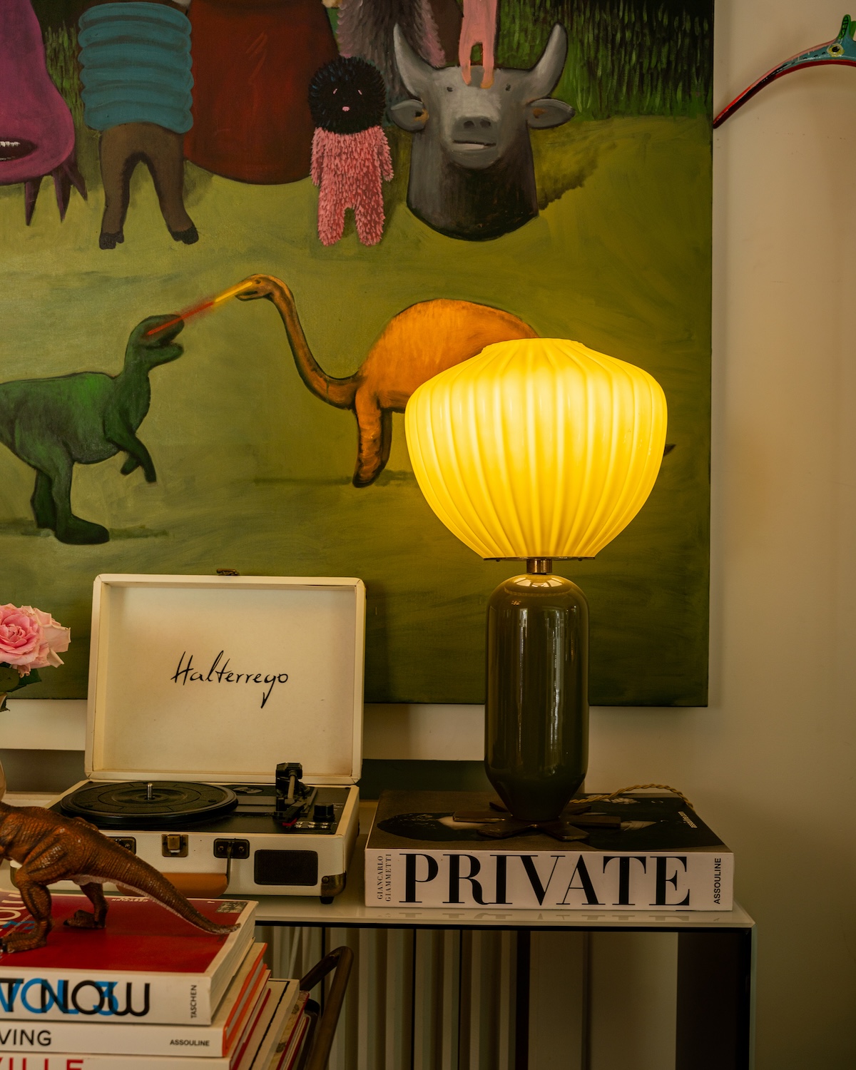 Table lamp and record player before a painting