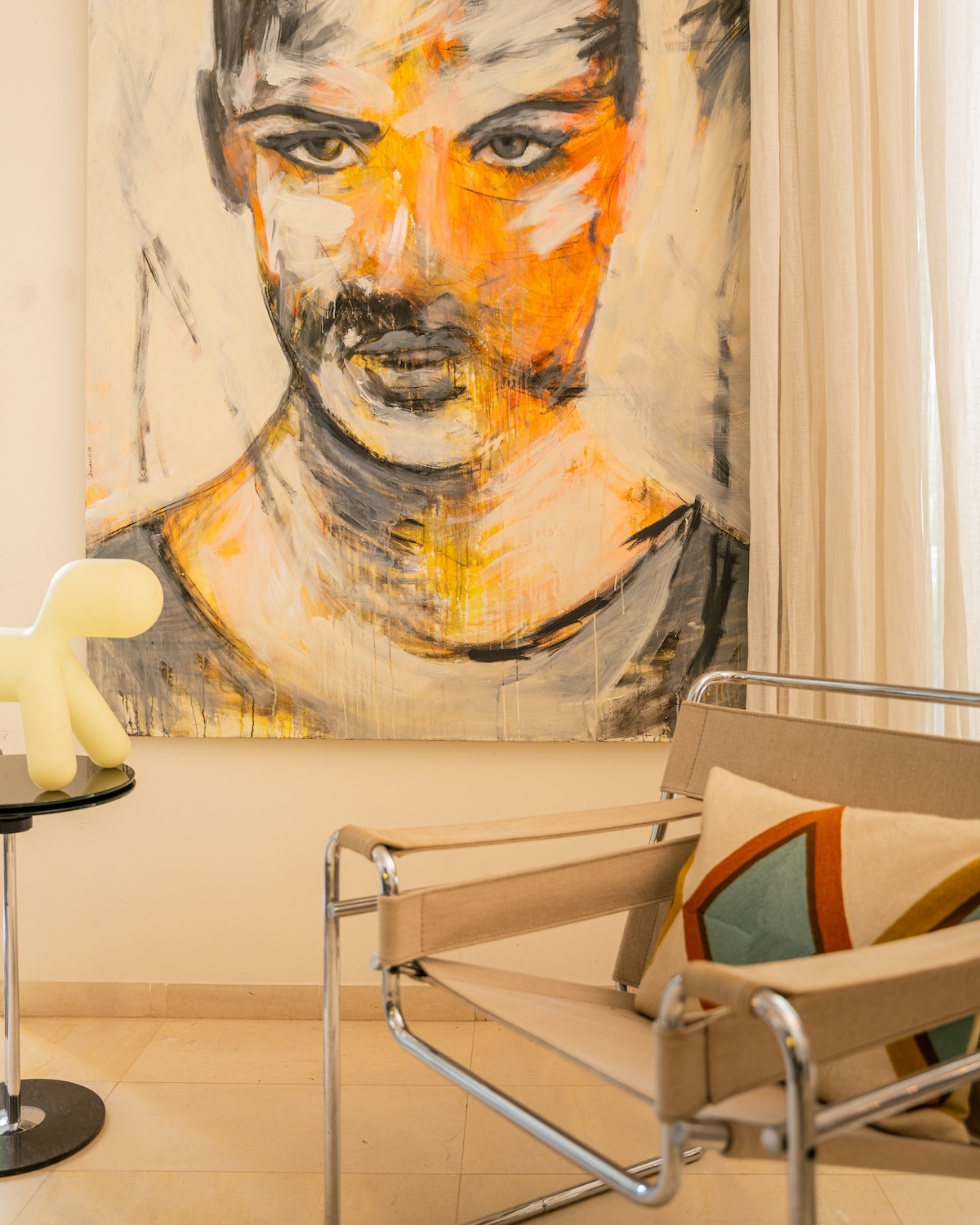 Wassily chair before a large portrait painting