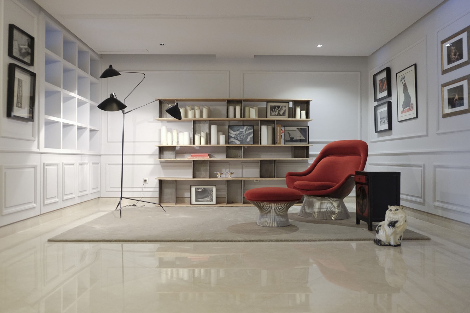 Library with red armchair and floor lamp