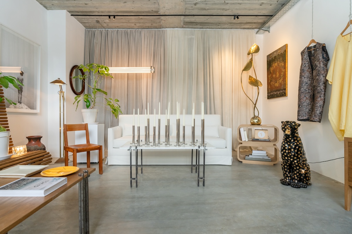 Improvisation #6 interior with white sofa, glass table, artworks and collected objects