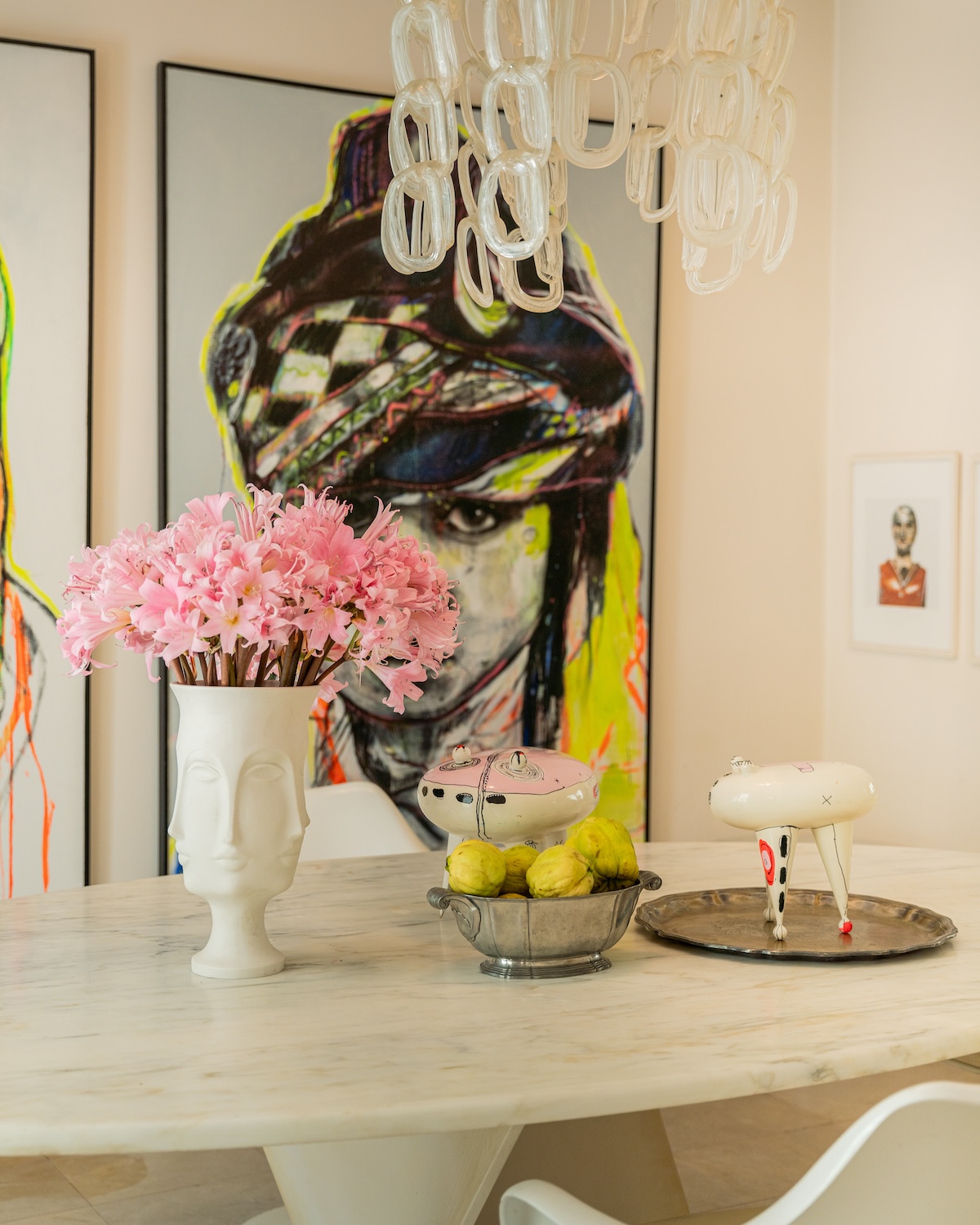 Marble table detail with flowers and ceramics