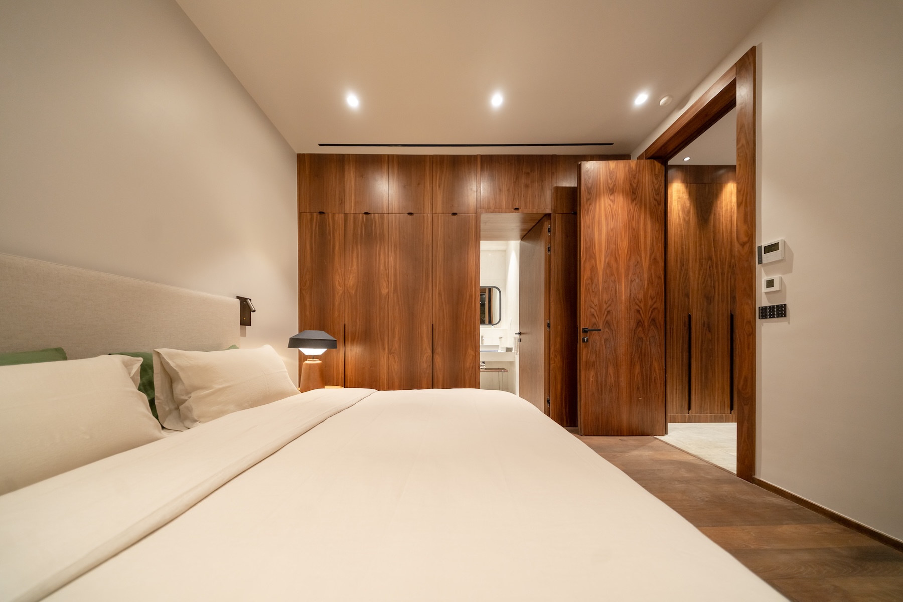Bedroom with walnut wardrobes